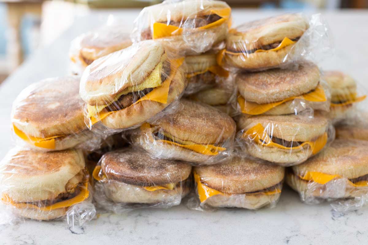 All the breakfast sandwiches have been wrapped in plastic wrap and are ready for the freezer.