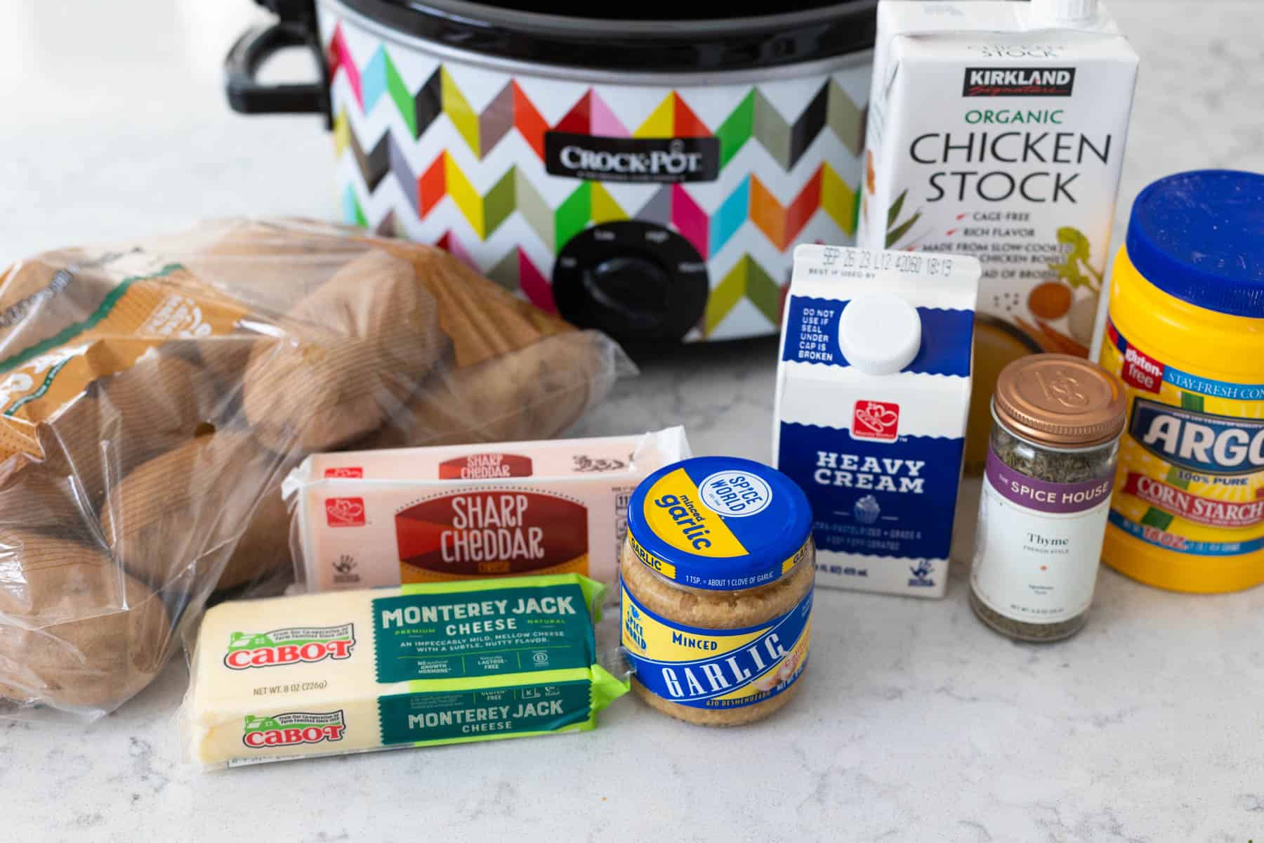 The ingredients to make scalloped potatoes in the slowcooker are on the kitchen counter.