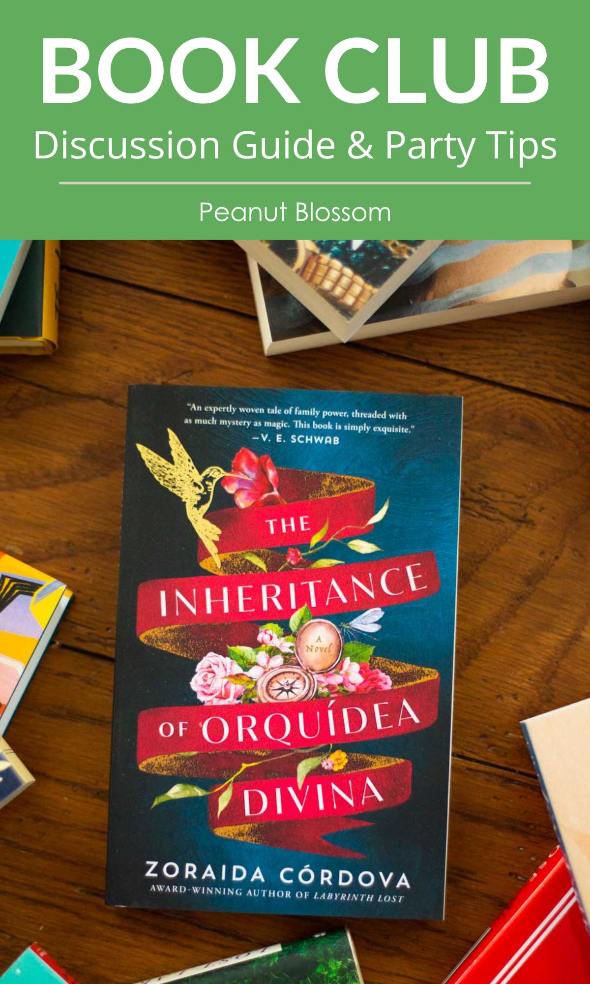 A copy of the book The Inheritance of Orquídea Divina sits on a table.