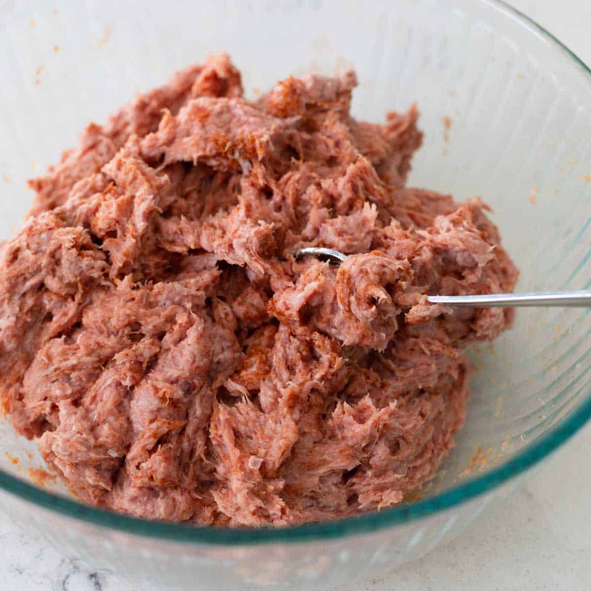 The ground turkey has been fluffed with a fork to make the sausage mix.