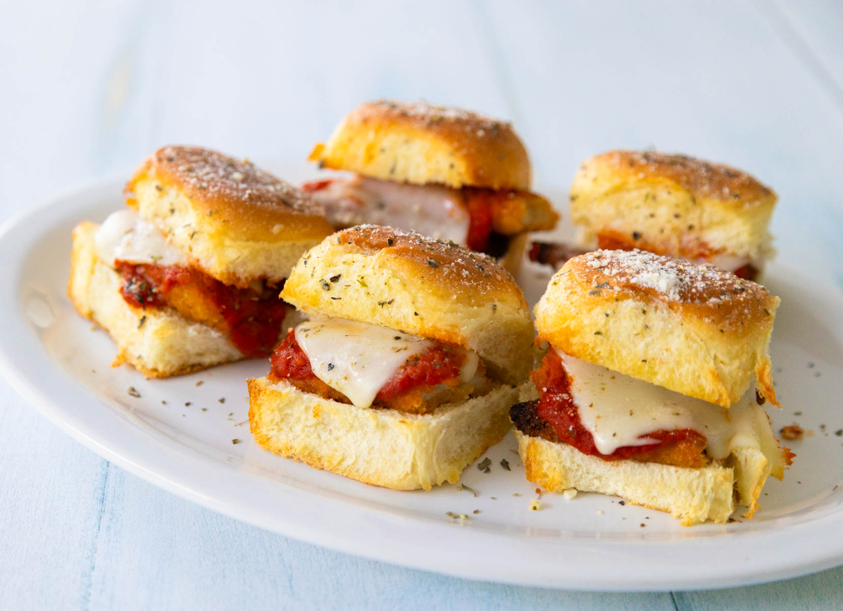 The platter of chicken parm sliders is ready to be served at the party.