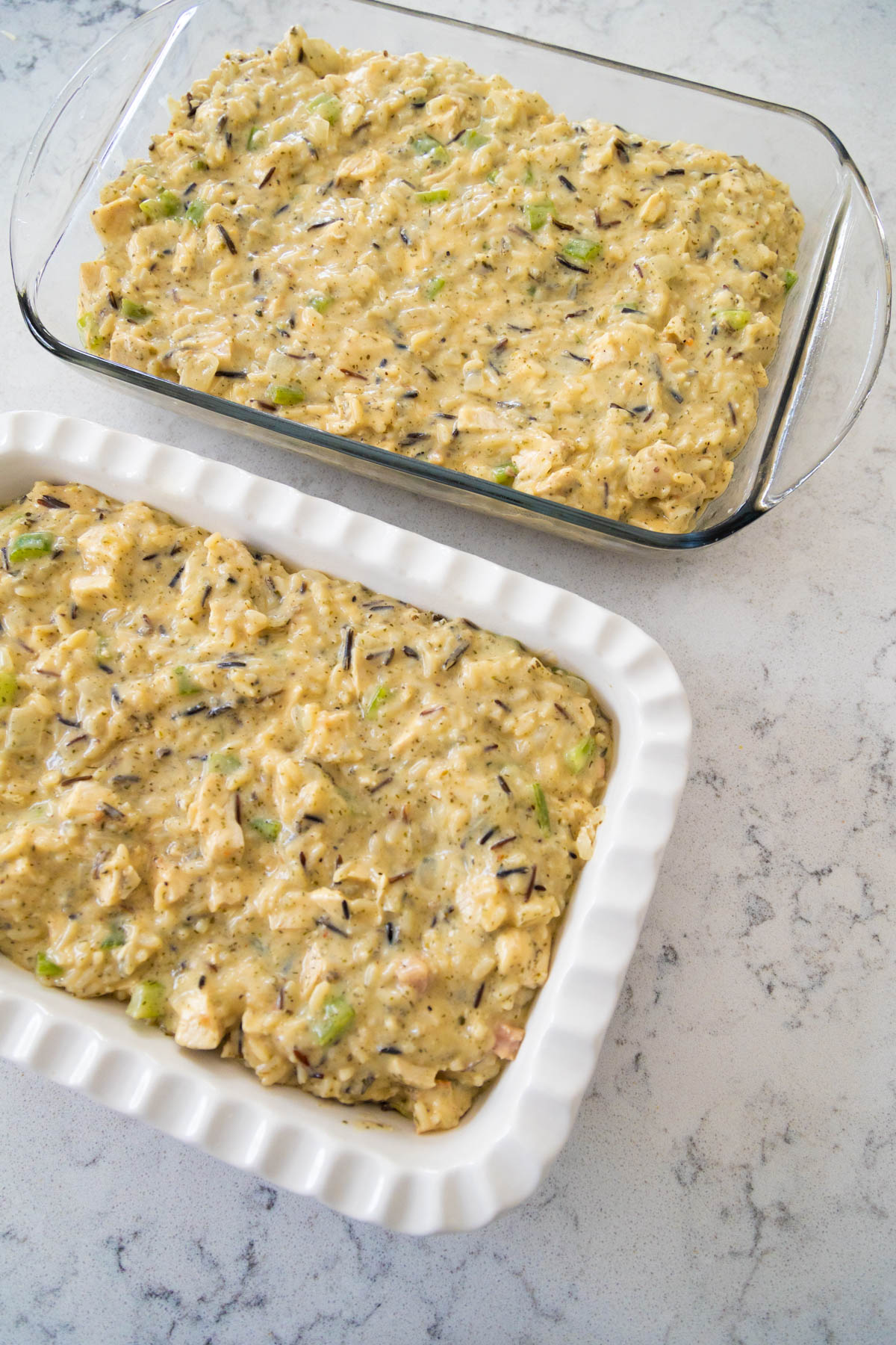 The chicken wild rice casserole has been split into two baking dishes, one to bake now and one to freeze.