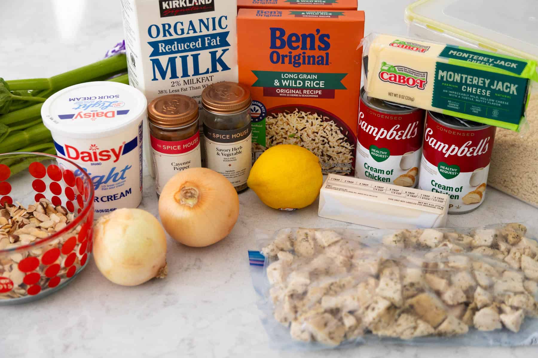 The ingredients to make chicken wild rice casserole are on the counter.