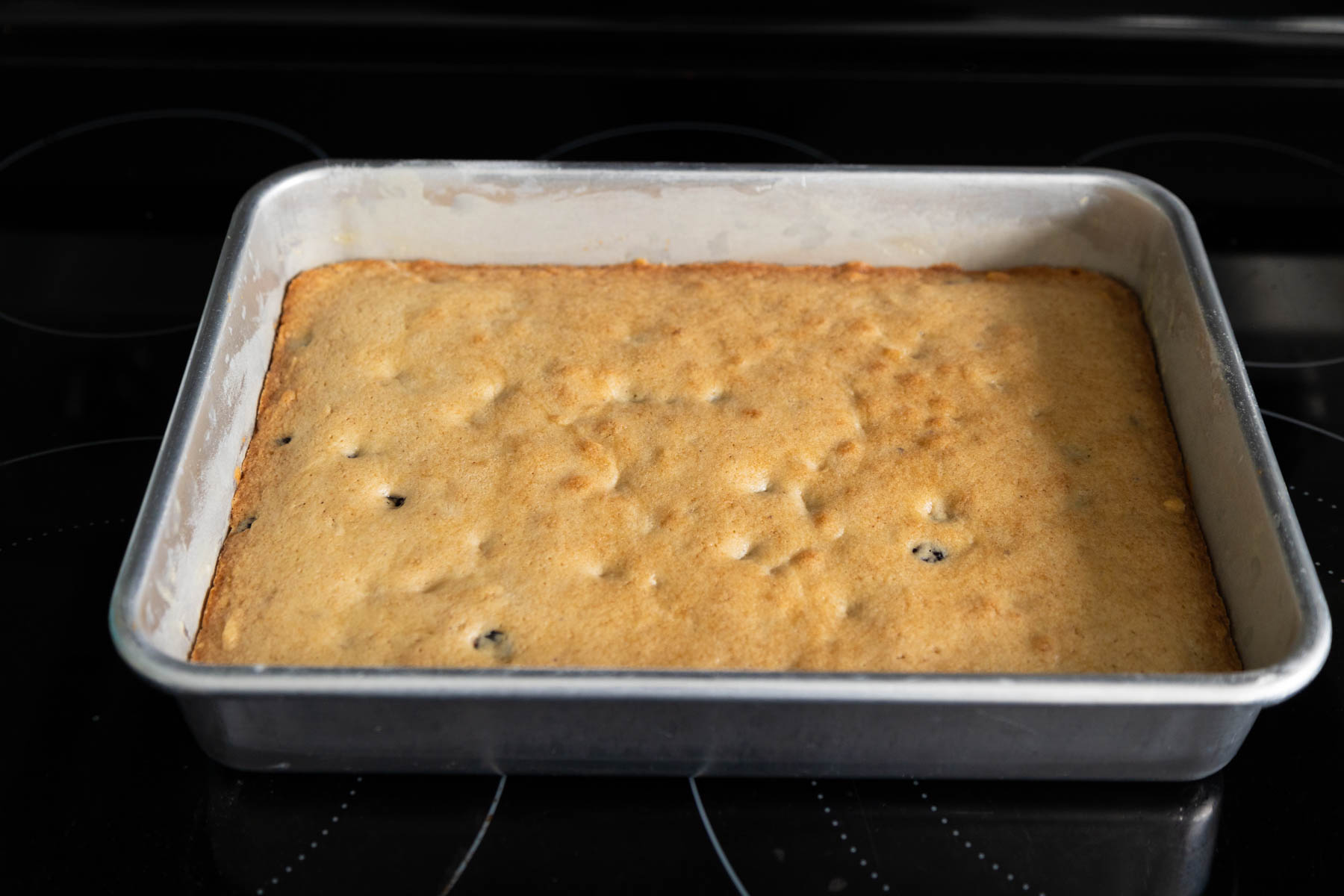 The baked cookie dough bars are just out of the oven, the top is golden brown.