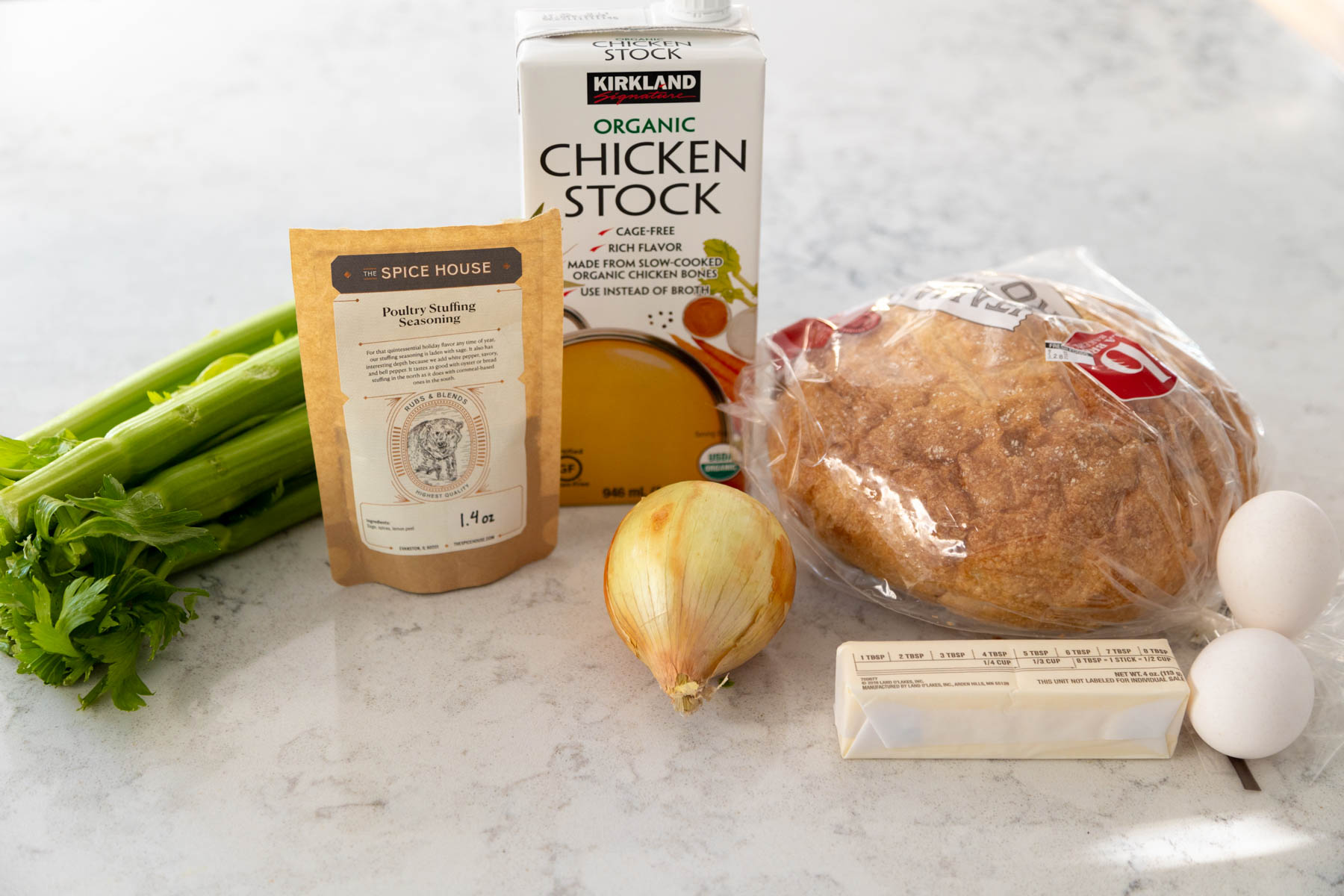 All the ingredients to make stuffing in a slowcooker are on the counter.