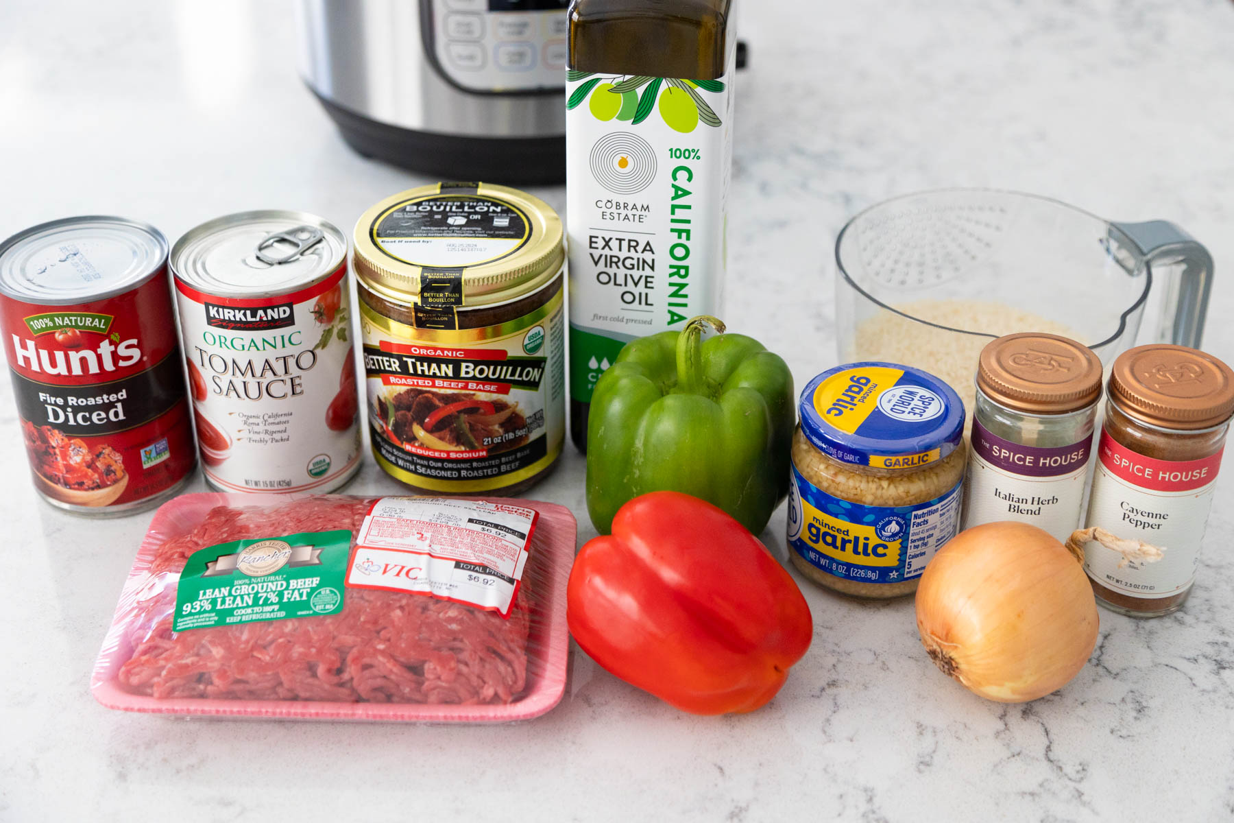 All the ingredients to make stuffed pepper soup in an Instant Pot are on the counter.