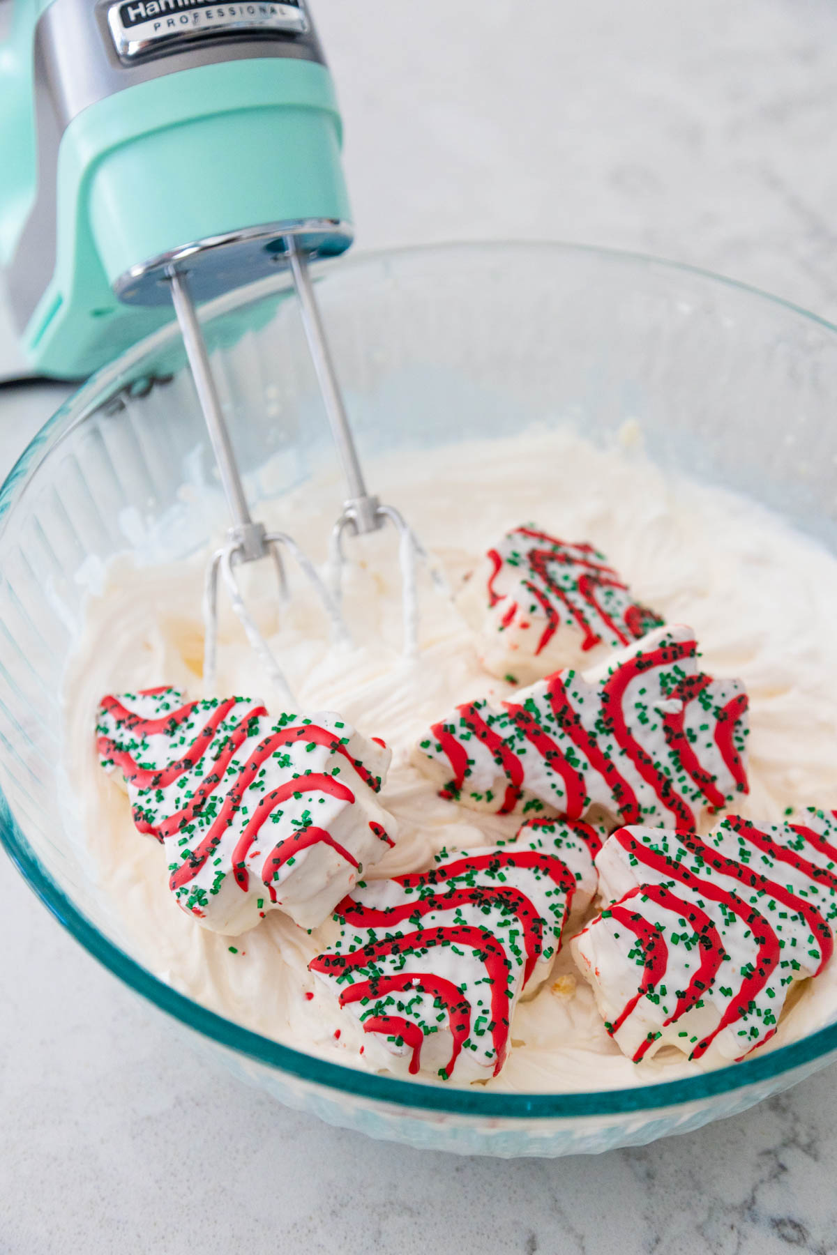 The Little Debbie Christmas Tree cakes are in the mixing bowl about to be blended in.