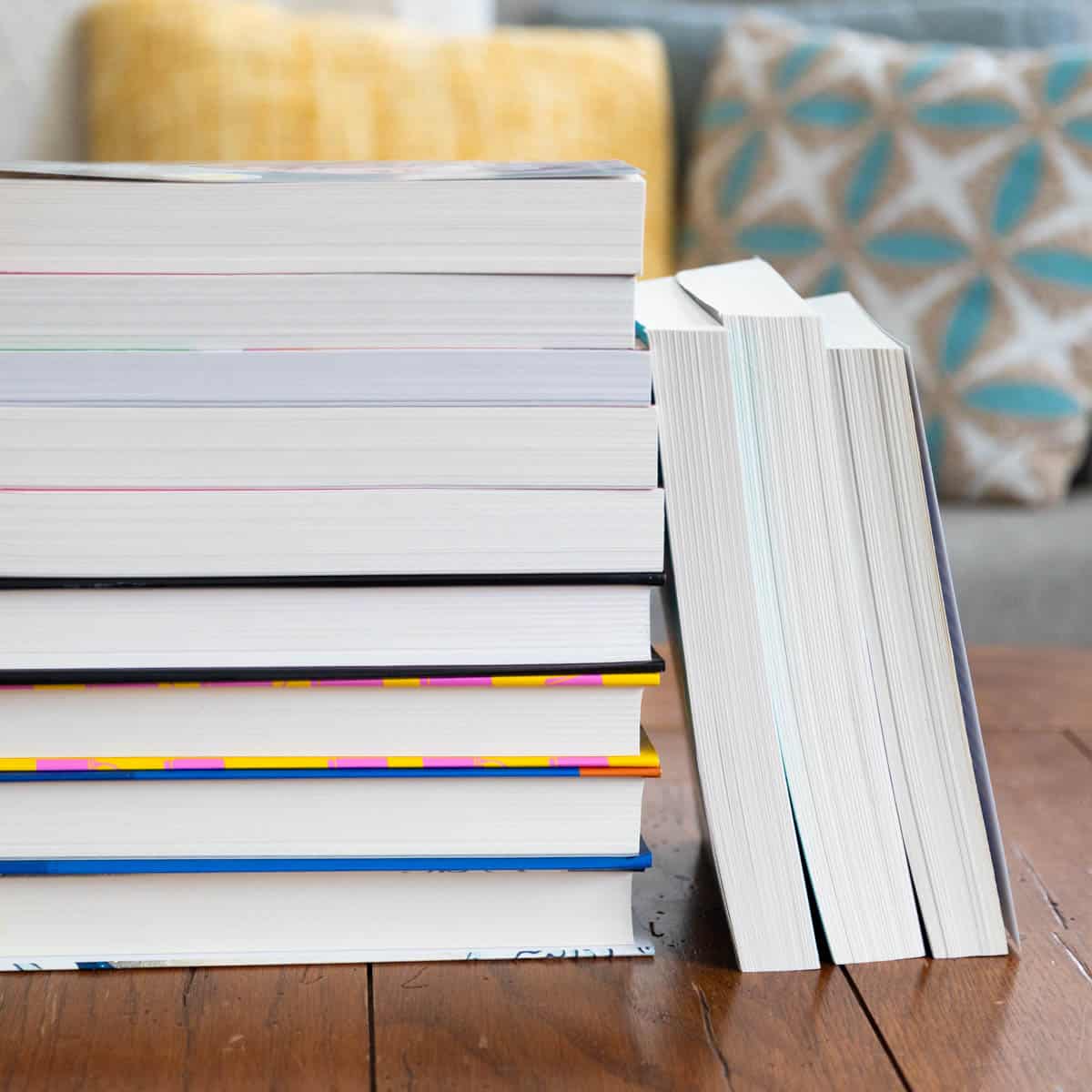 A stack of books with the spines hidden so you can't see the titles just yet.