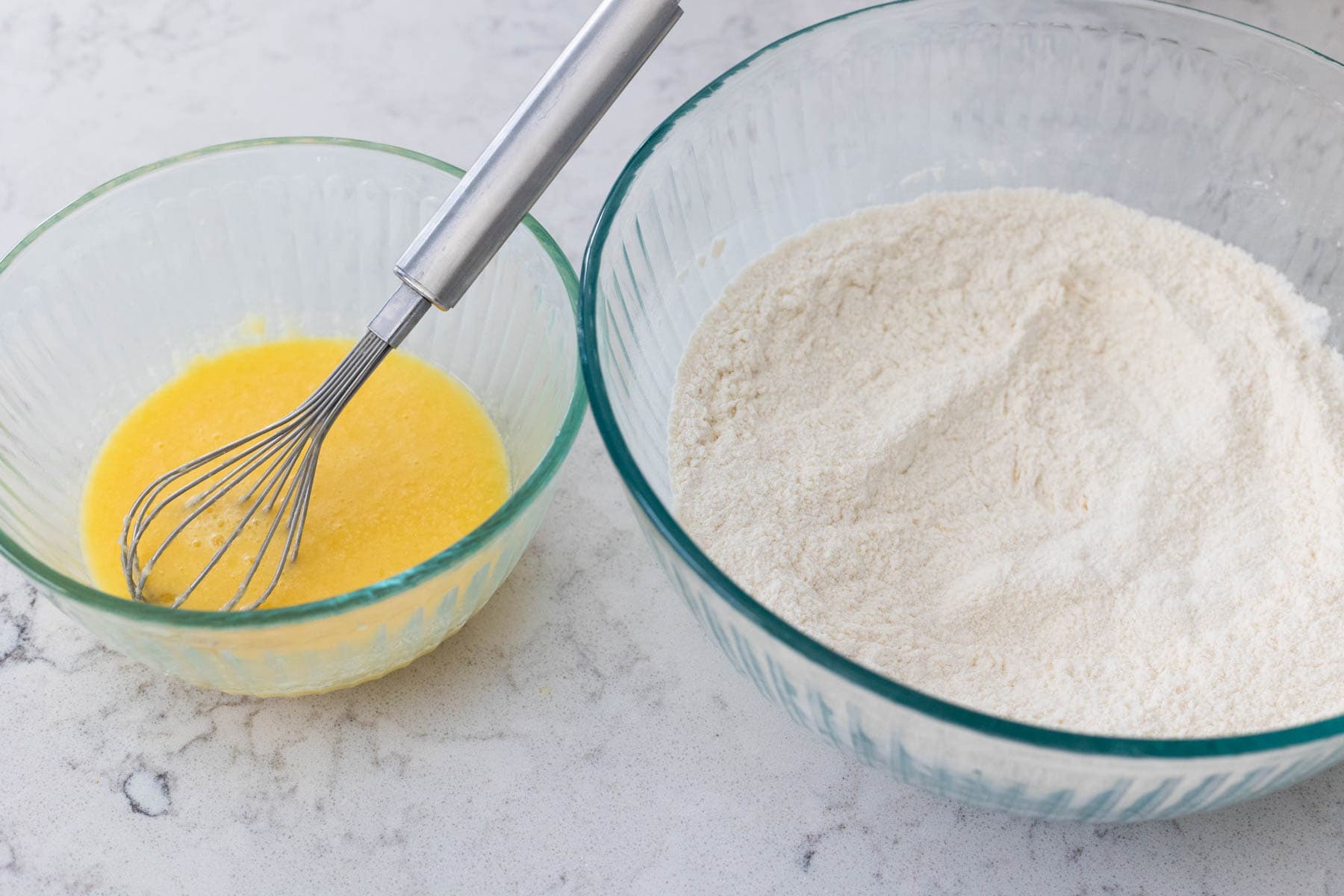 The egg, butter, and orange juice have been whisked together in a separate small bowl.