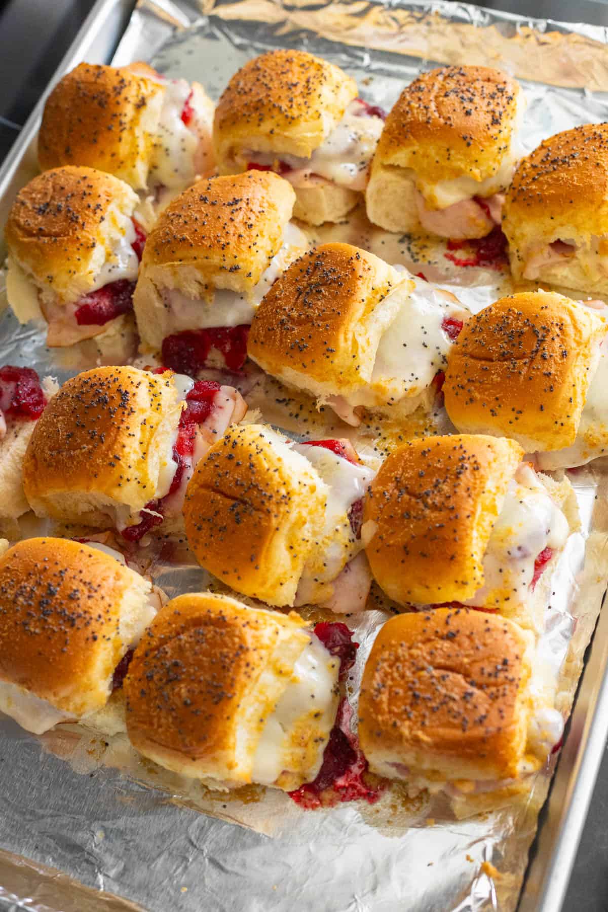 The pan of sliders have just come out of the oven and are golden brown on top.