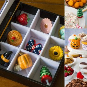 A box of Nora Fleming holiday minis next to cute photos using them for food displays.