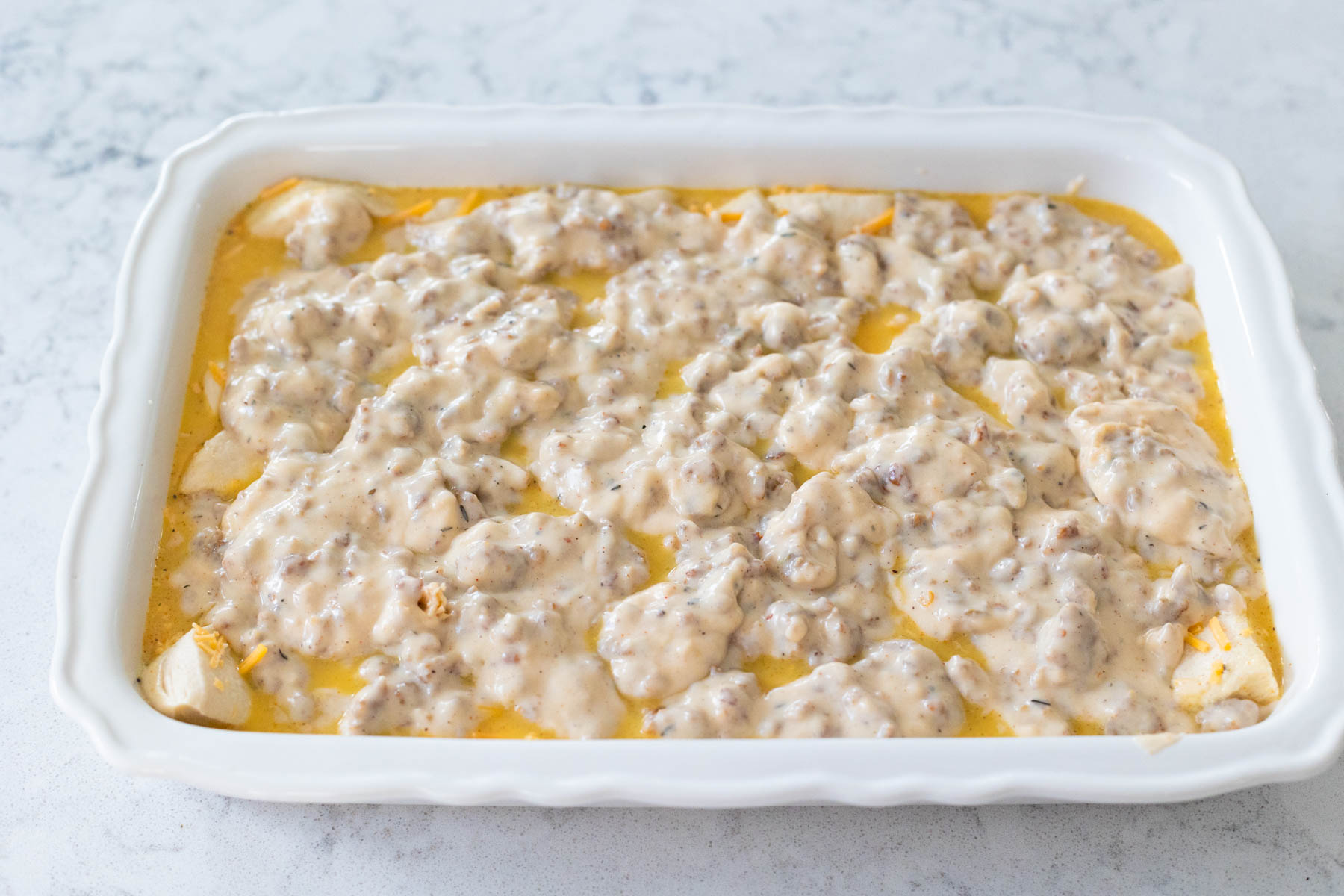 The biscuits and gravy casserole is ready for the oven.