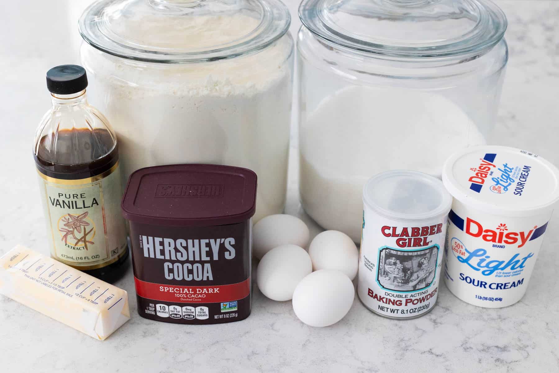 The ingredients to make the chocolate sponge cake for the yule log are on the counter.