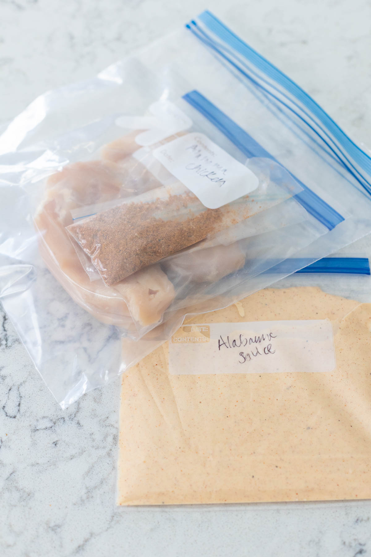 The chicken, seasonings, and Alabama white sauce have been packaged for the freezer.