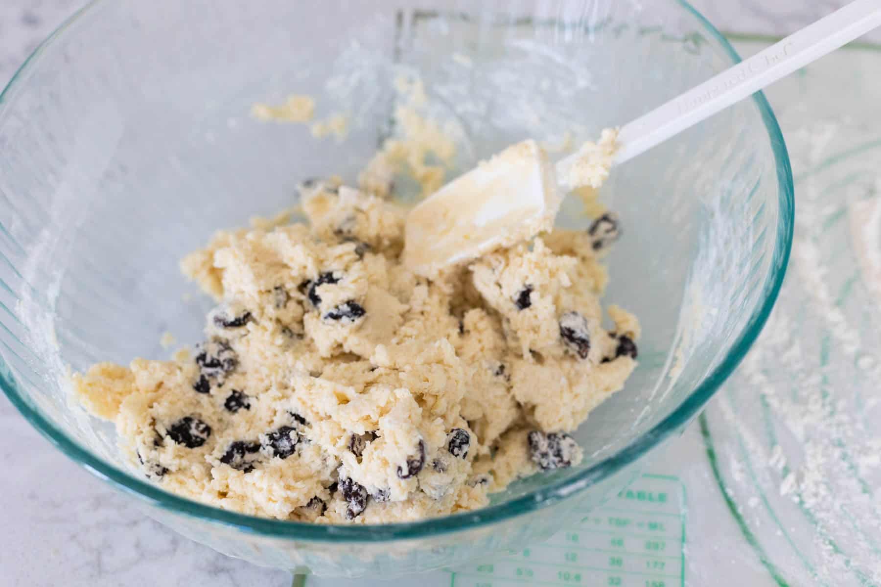 The dough to make scones has come together in the mixing bowl but still looks a bit shaggy.