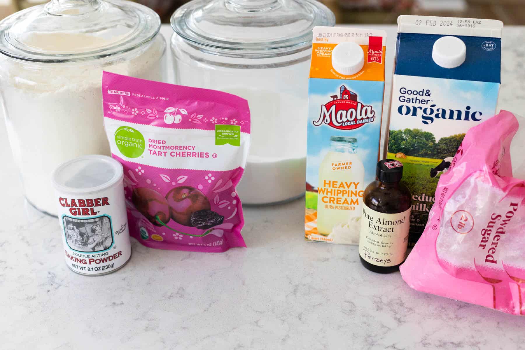 The ingredients to make almond cherry scones are on the counter.