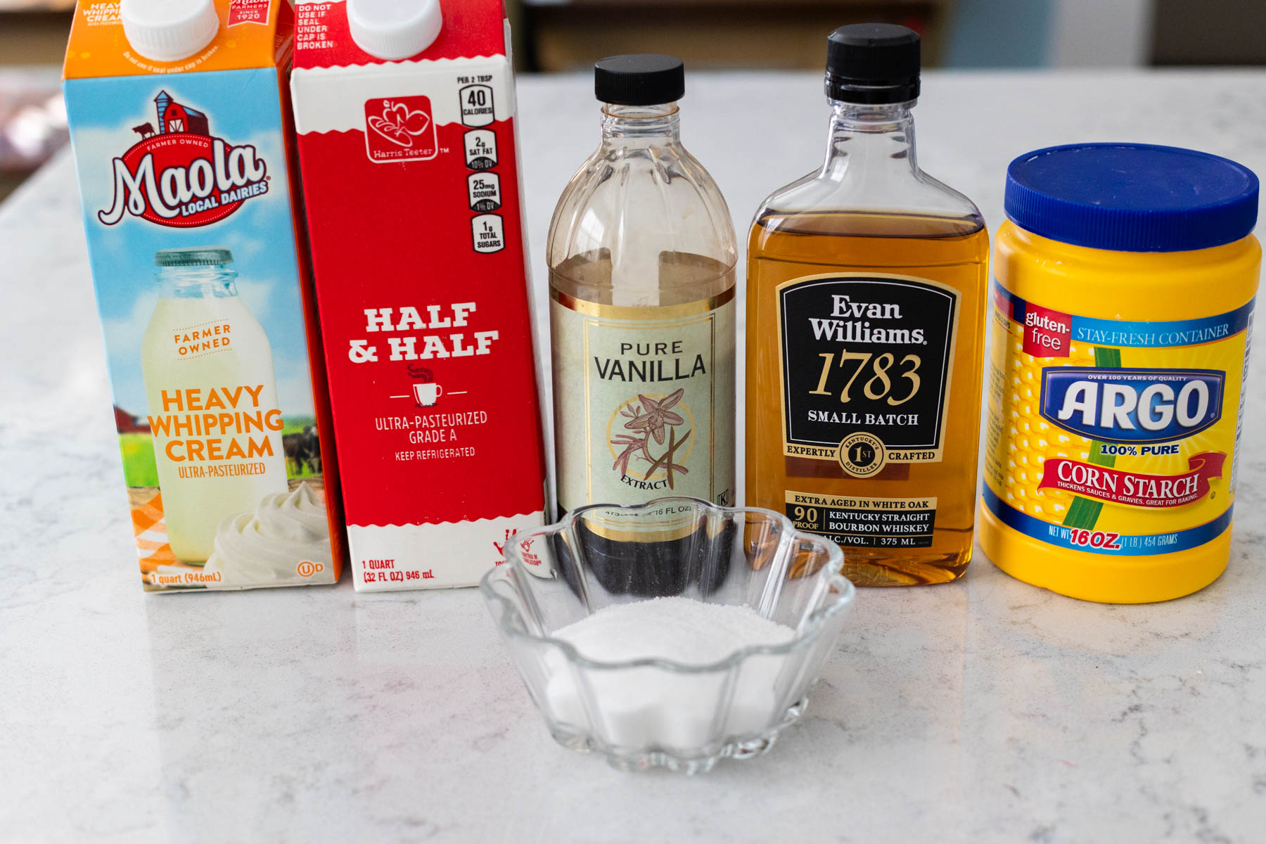 The ingredients to make bourbon sauce are on the counter.