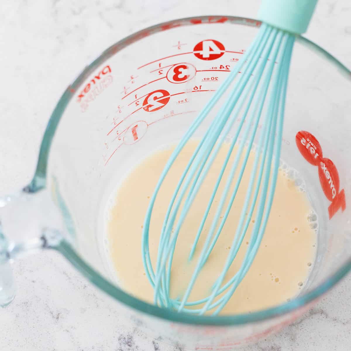 The bourbon and cornstarch have been whisked together and are creamy and smooth.