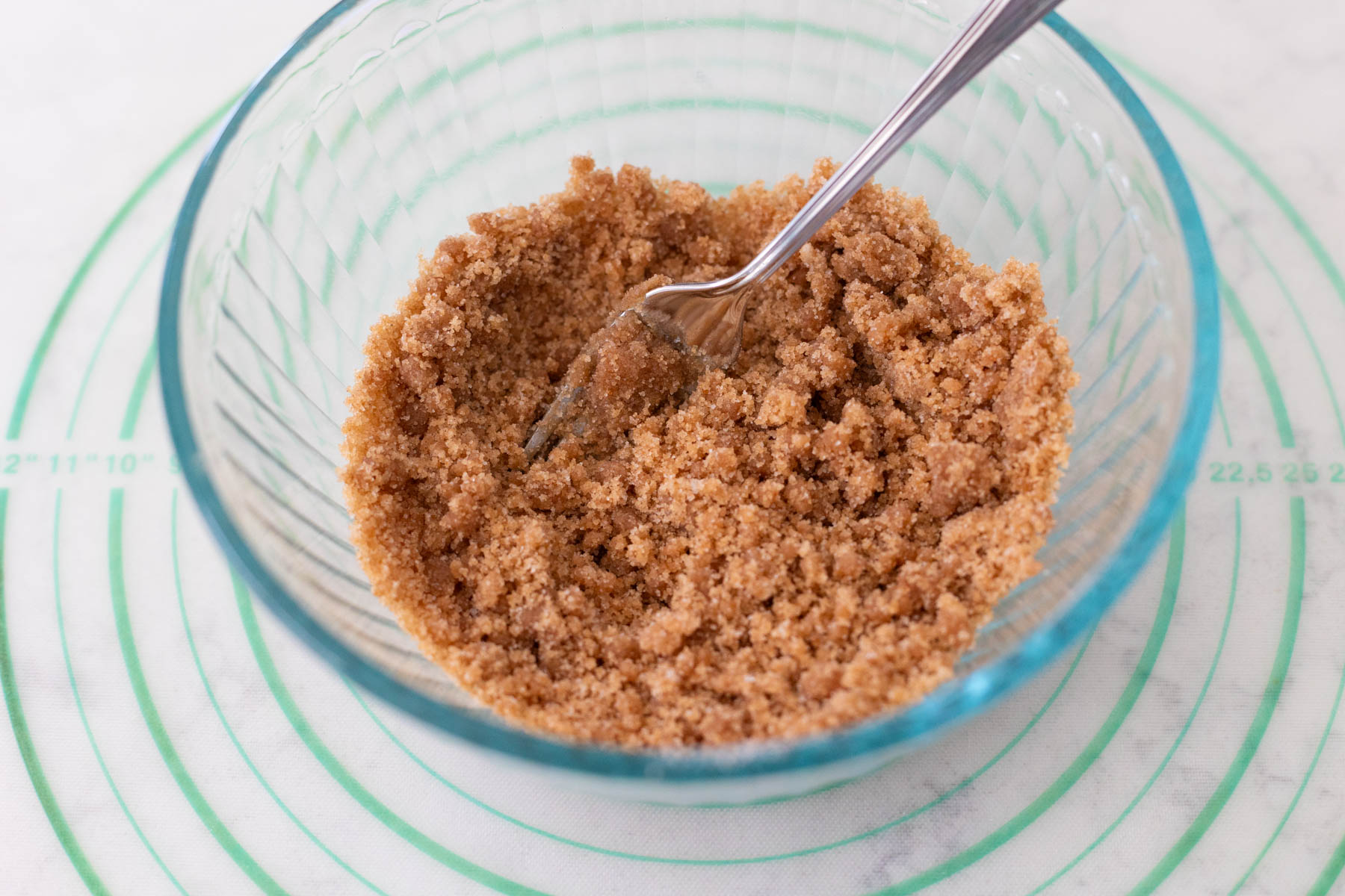 The brown sugar and cinnamon filling has been mixed together in a small mixing bowl.