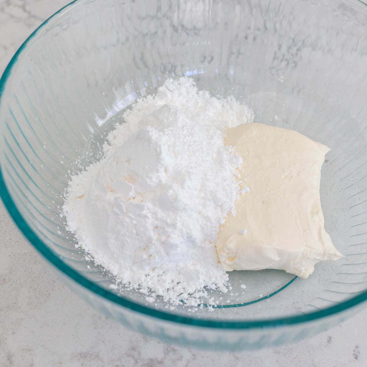 The Cream Cheese and Powdered Sugar are in a mixing bowl.