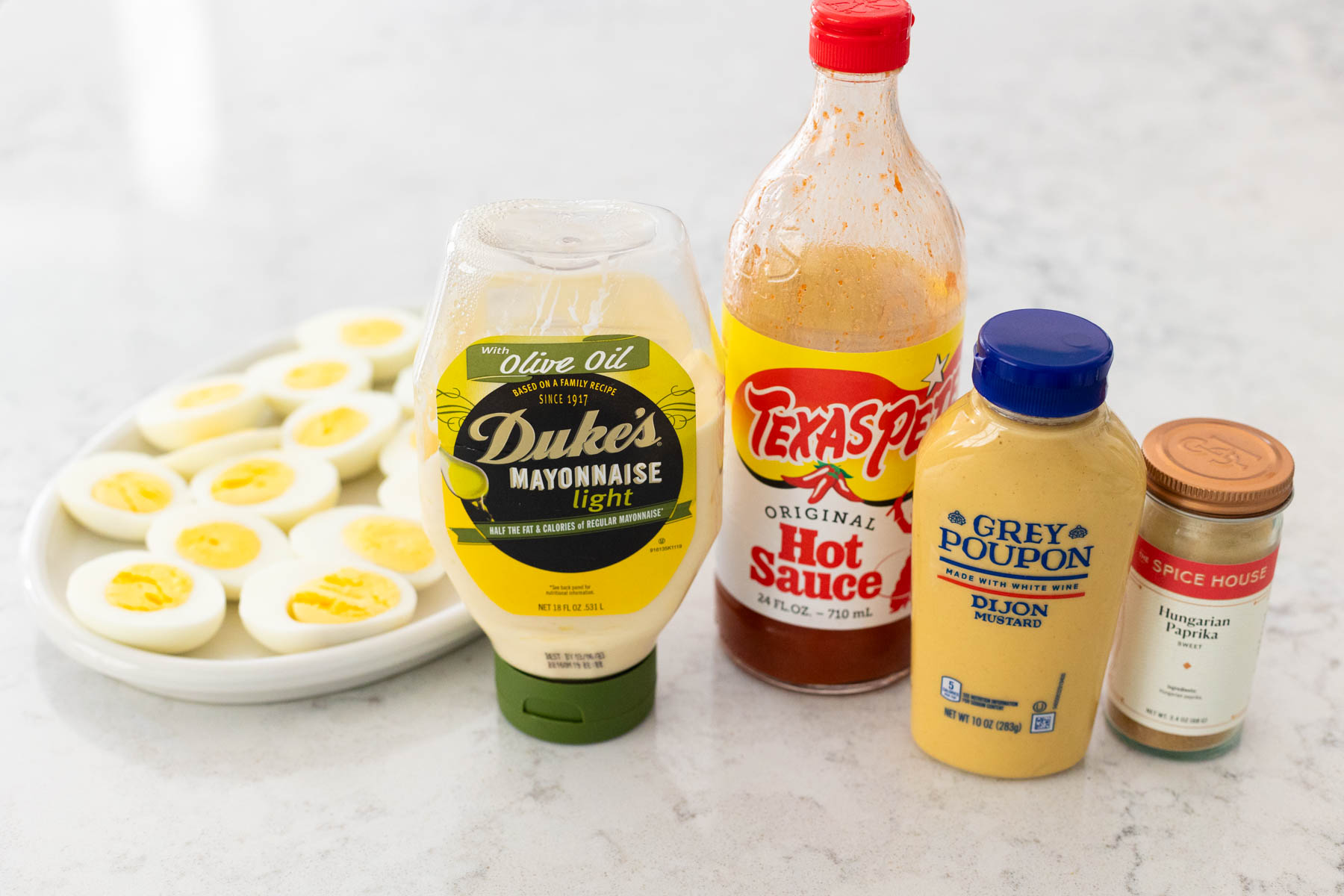 The ingredients to make deviled eggs are on the counter.