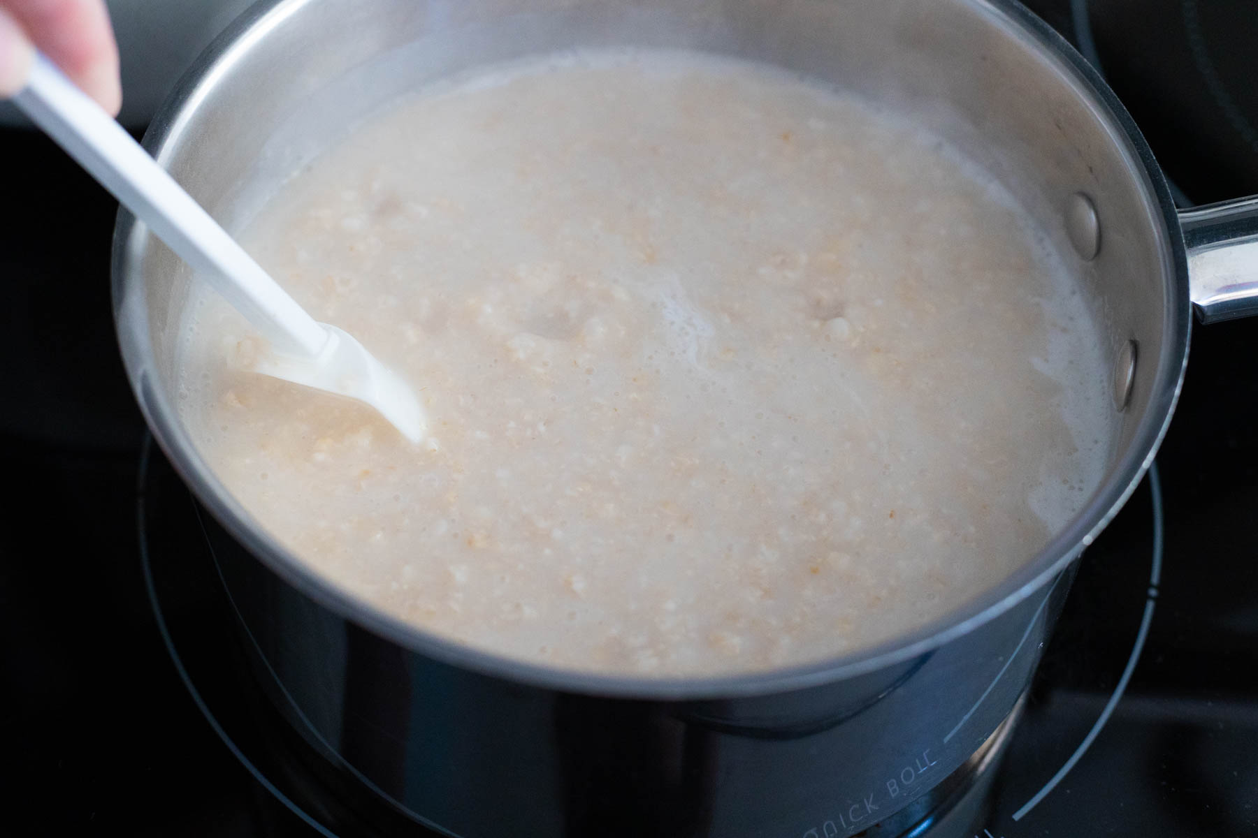 The oatmeal has been boiled and is quite thick.