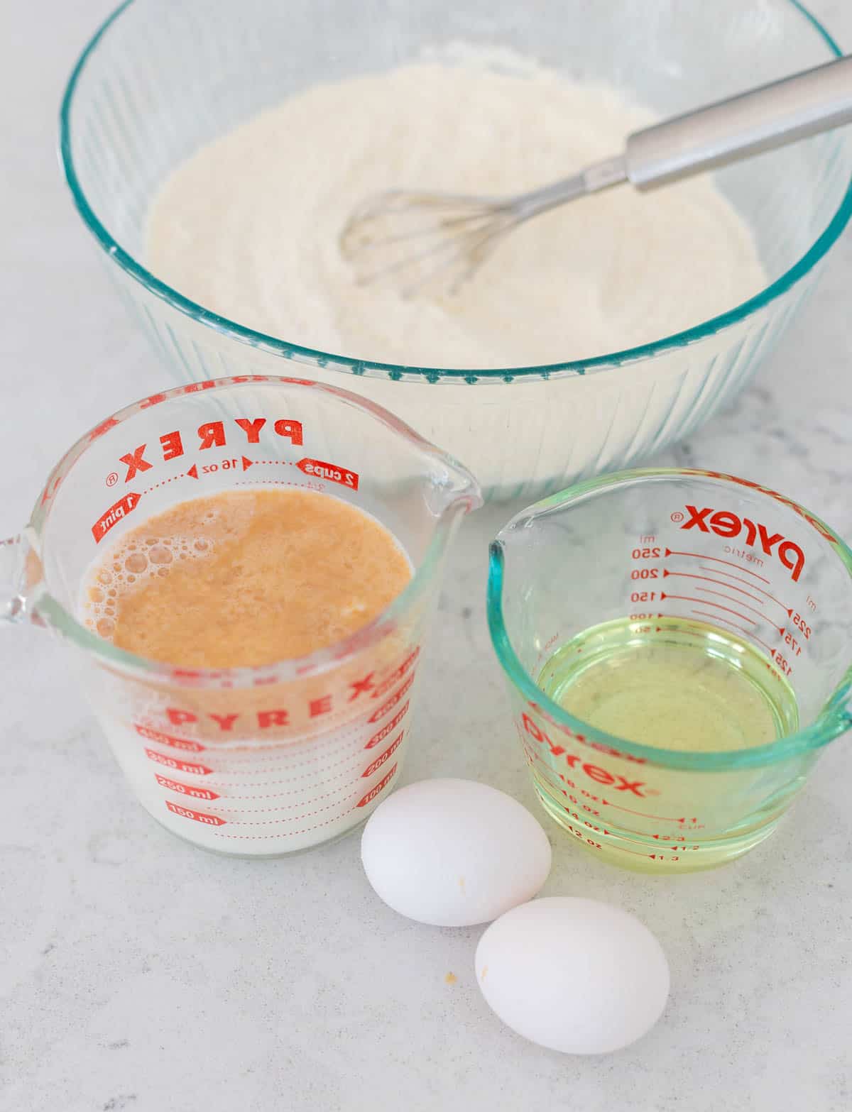 The liquid ingredients have been measured by the mixing bowl.