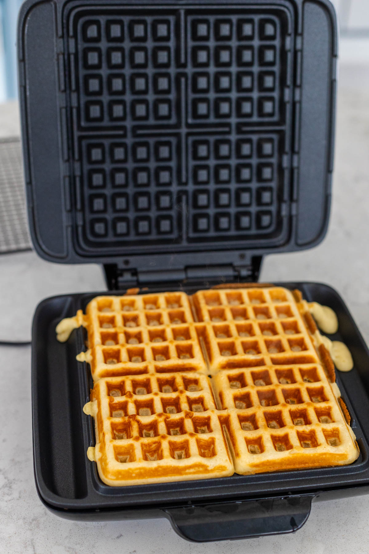The waffles are finished cooking and are a gorgeous crispy golden brown.