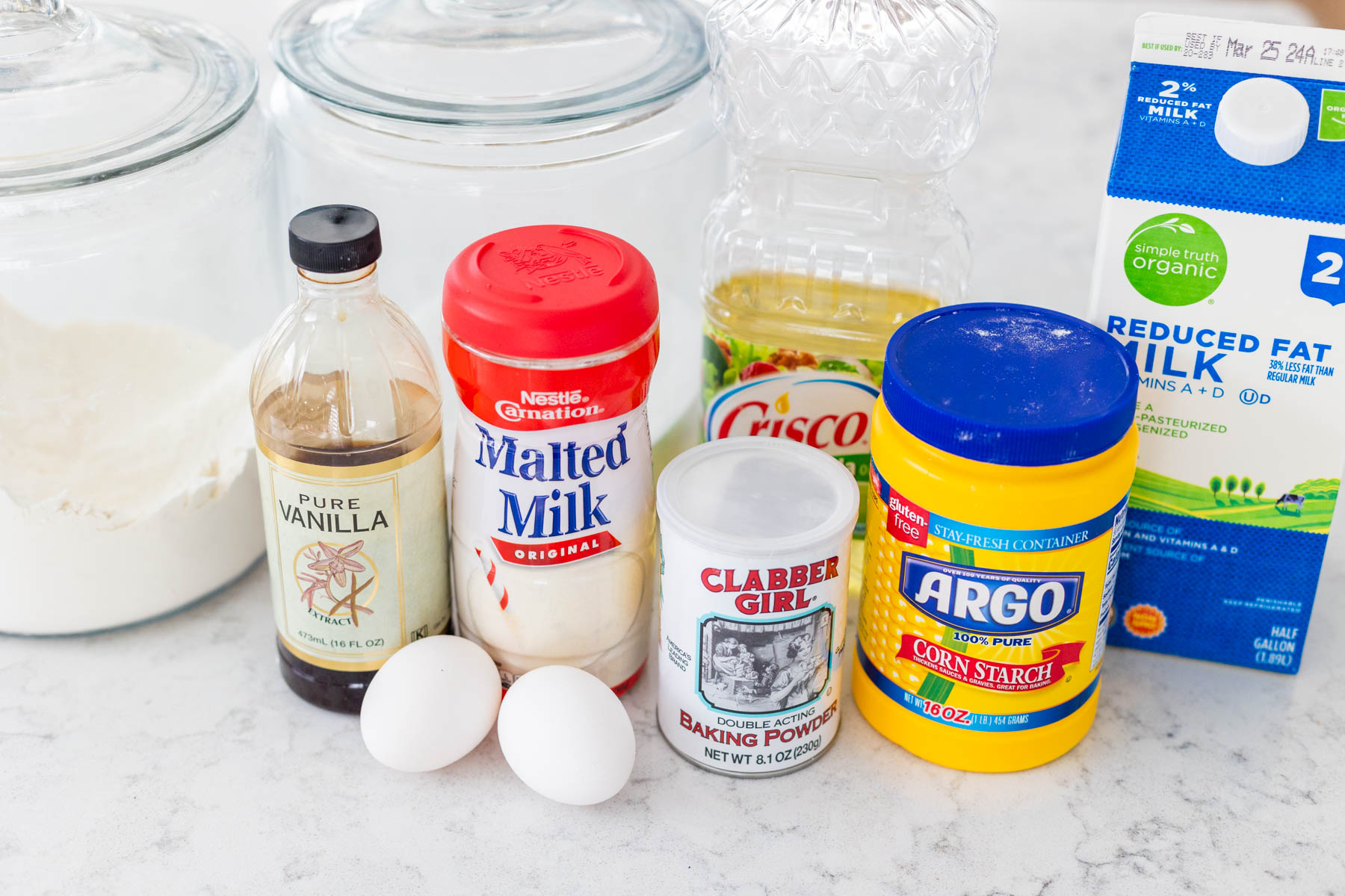 The ingredients to make malted waffles are on the counter.