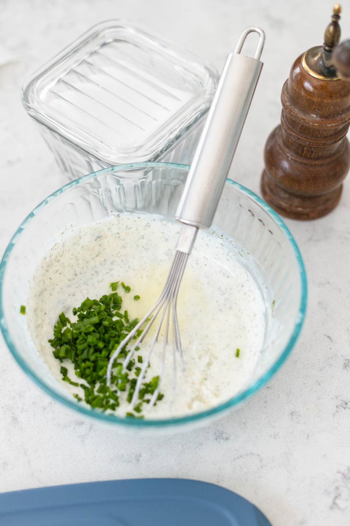 Fresh chives have been chopped and are about to be whisked into the dip.