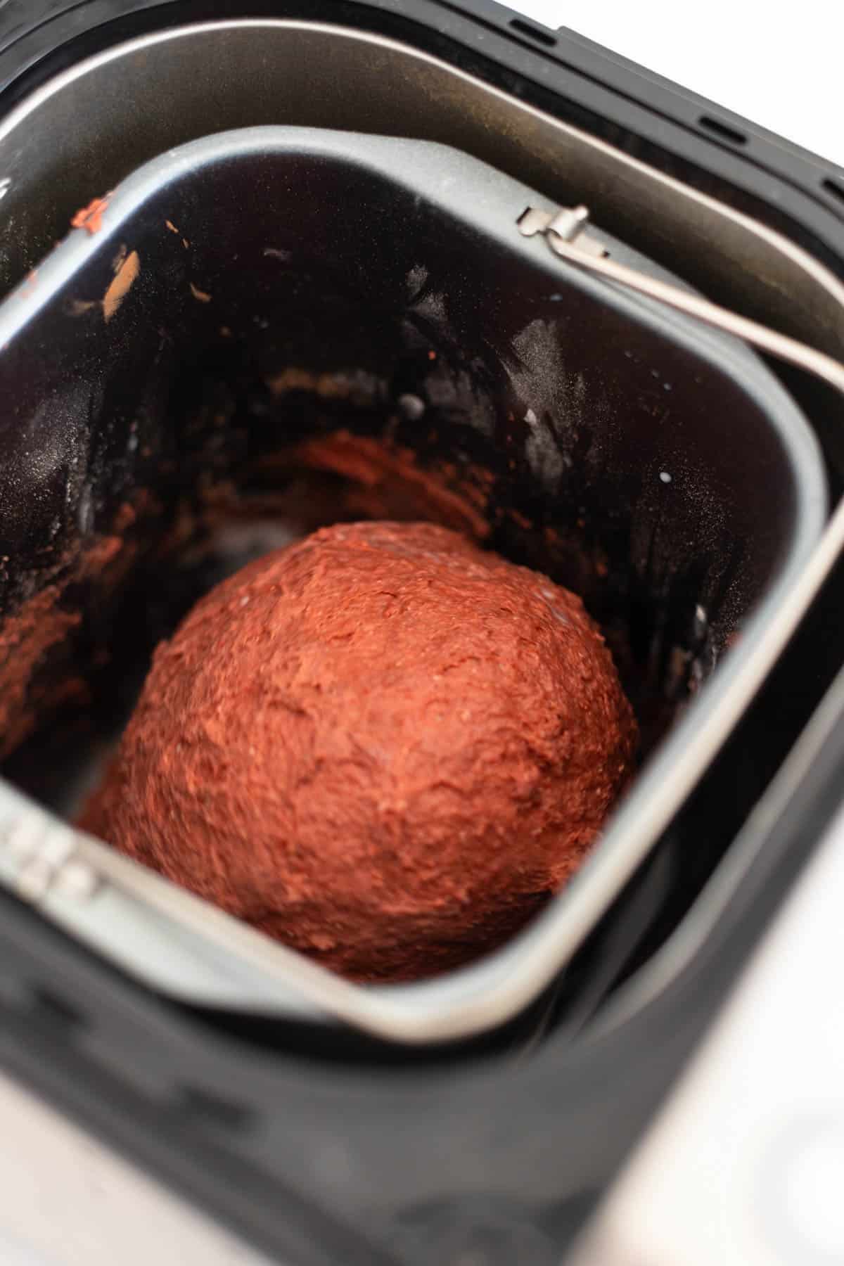 The dough ball has come together in the bread pan.