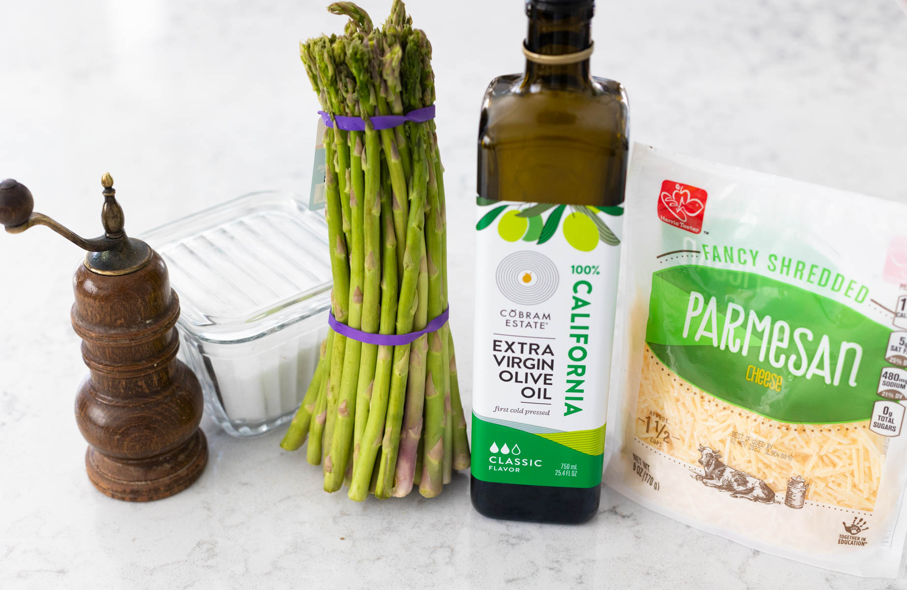 The ingredients to make the roasted asparagus are on the counter.