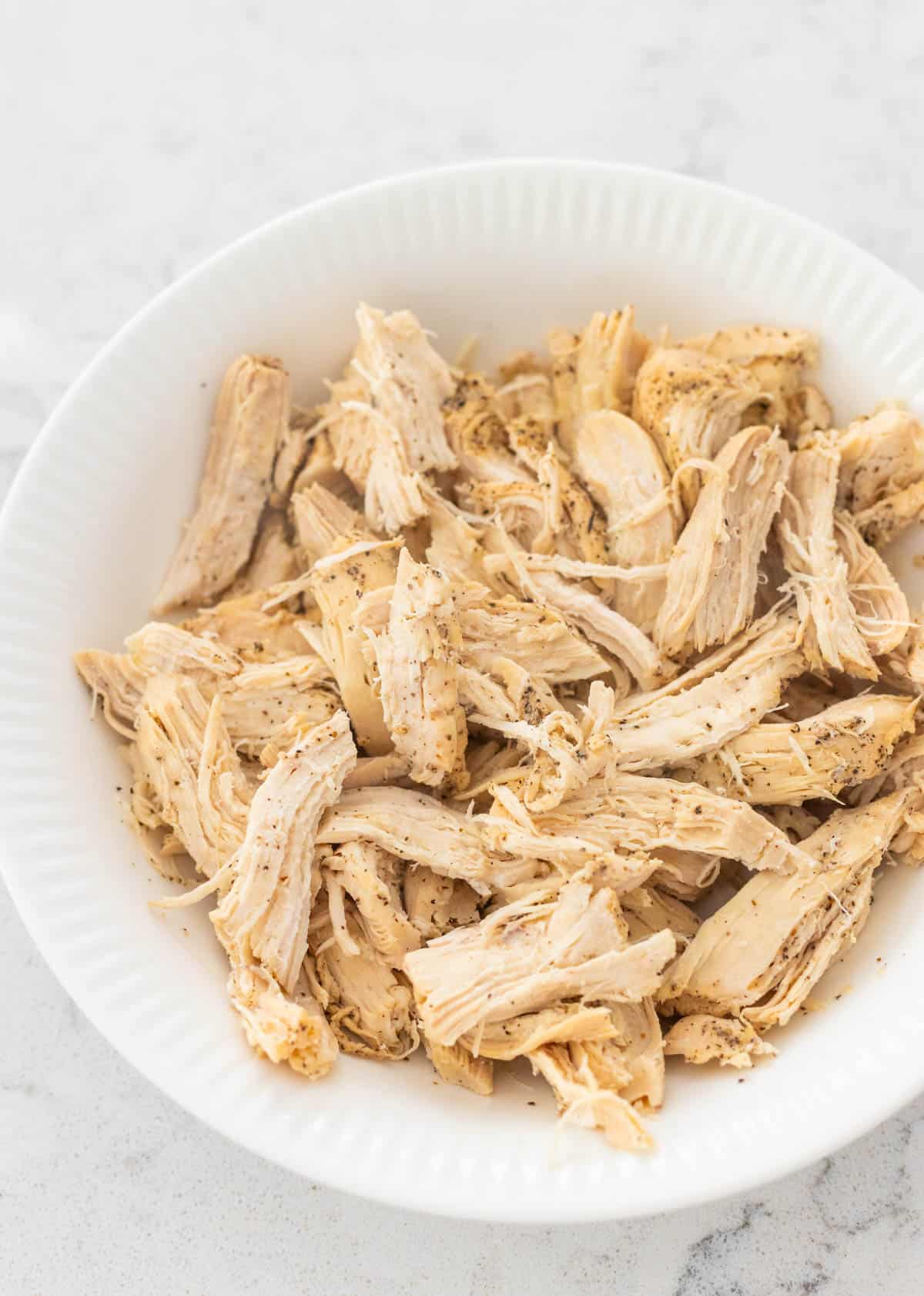 The chicken is ready to be used in a recipe.