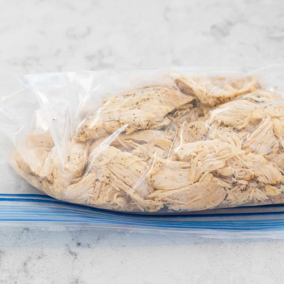 The chicken is ready to be frozen in a ziploc bag.