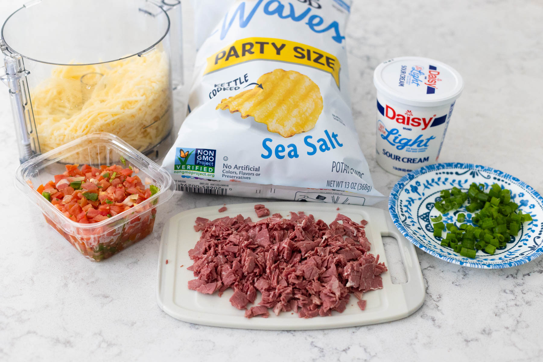 The ingredients to make Irish nachos are on the counter.