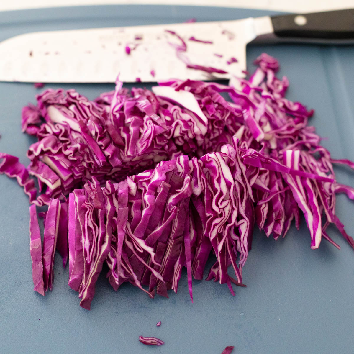 The thin strips of cabbage have been sliced in half again to make them shorter.