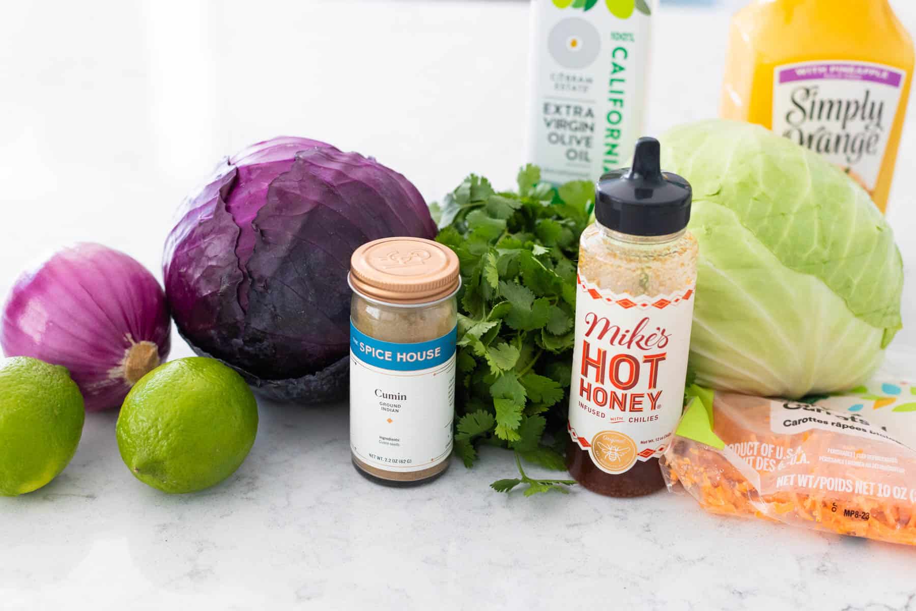 The ingredients to make the Mexican slaw are on the counter.