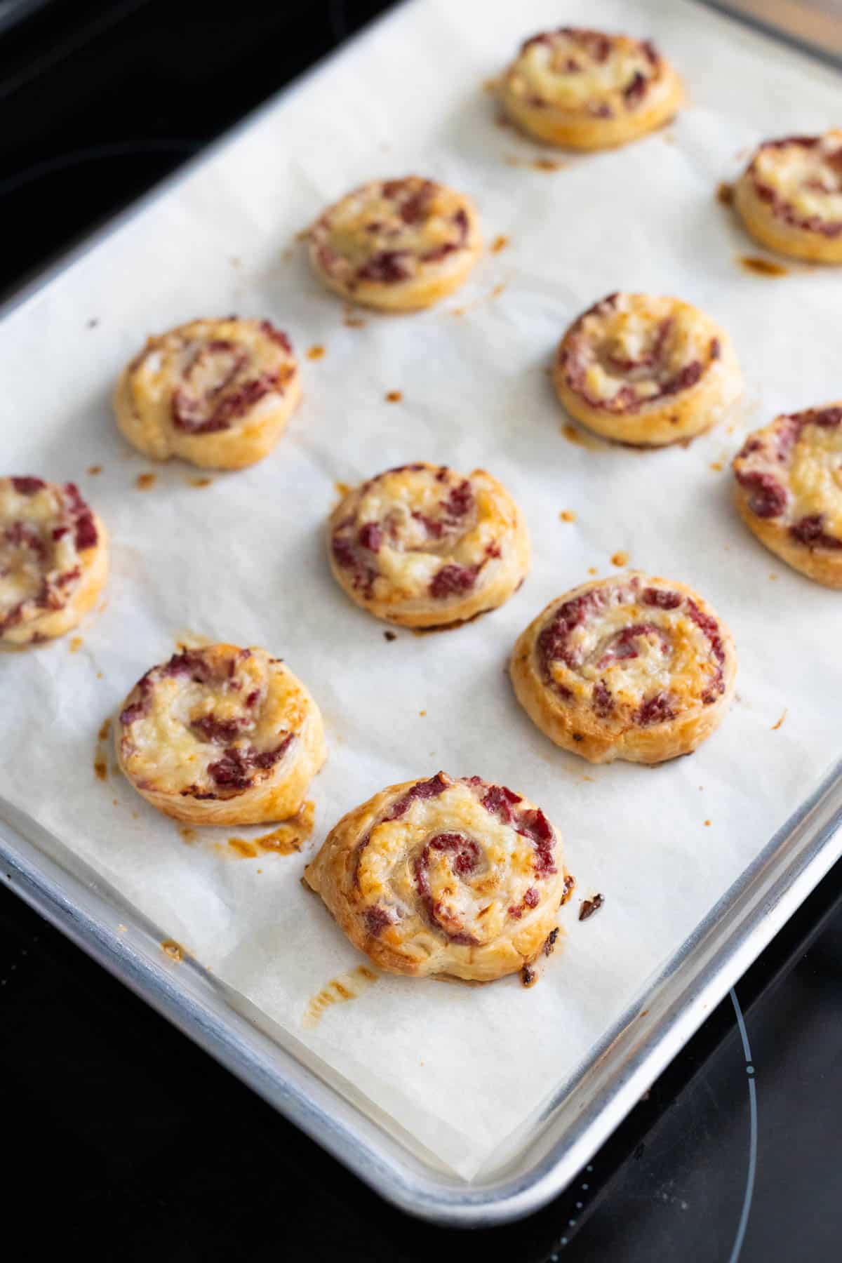 The reuben roll ups are fresh from the oven and a crispy golden brown.