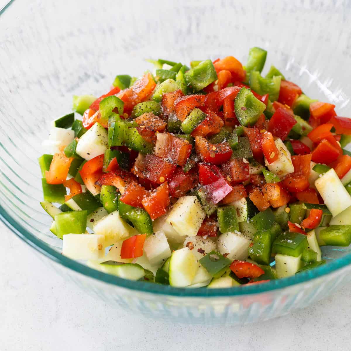 The chopped veggies are in a mixing bowl.