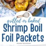 An aluminum foil packet is filled with cooked shrimp, corn on the cob, and potatoes.