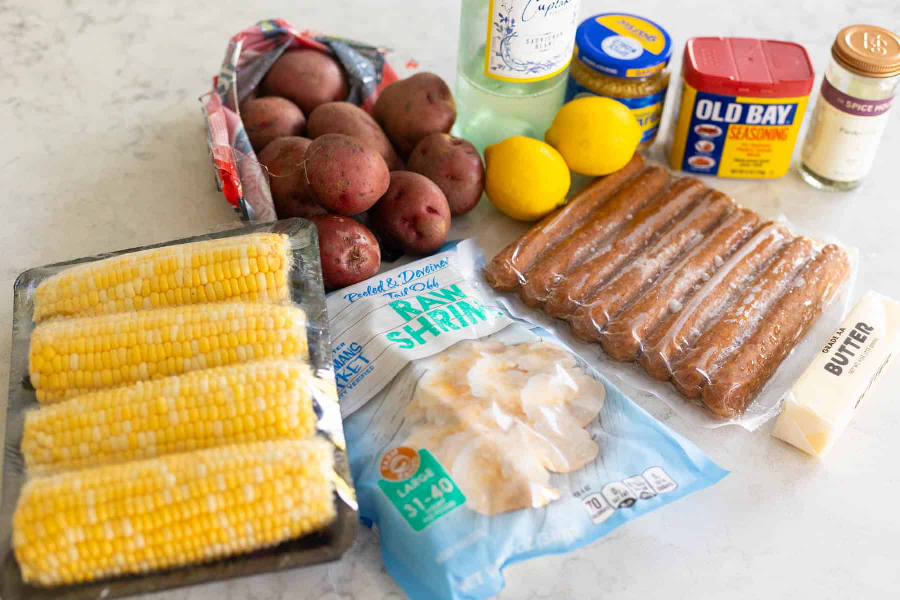 The ingredients to make the shrimp foil packets are on the counter.