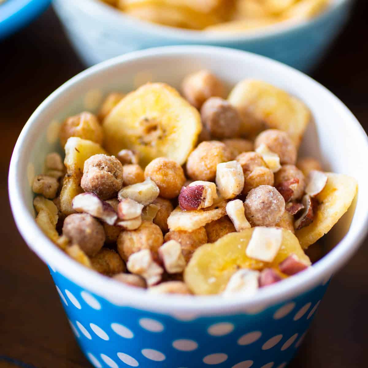 A peanut butter and chocolate cereal is mixed with dried bananas and hazelnuts.