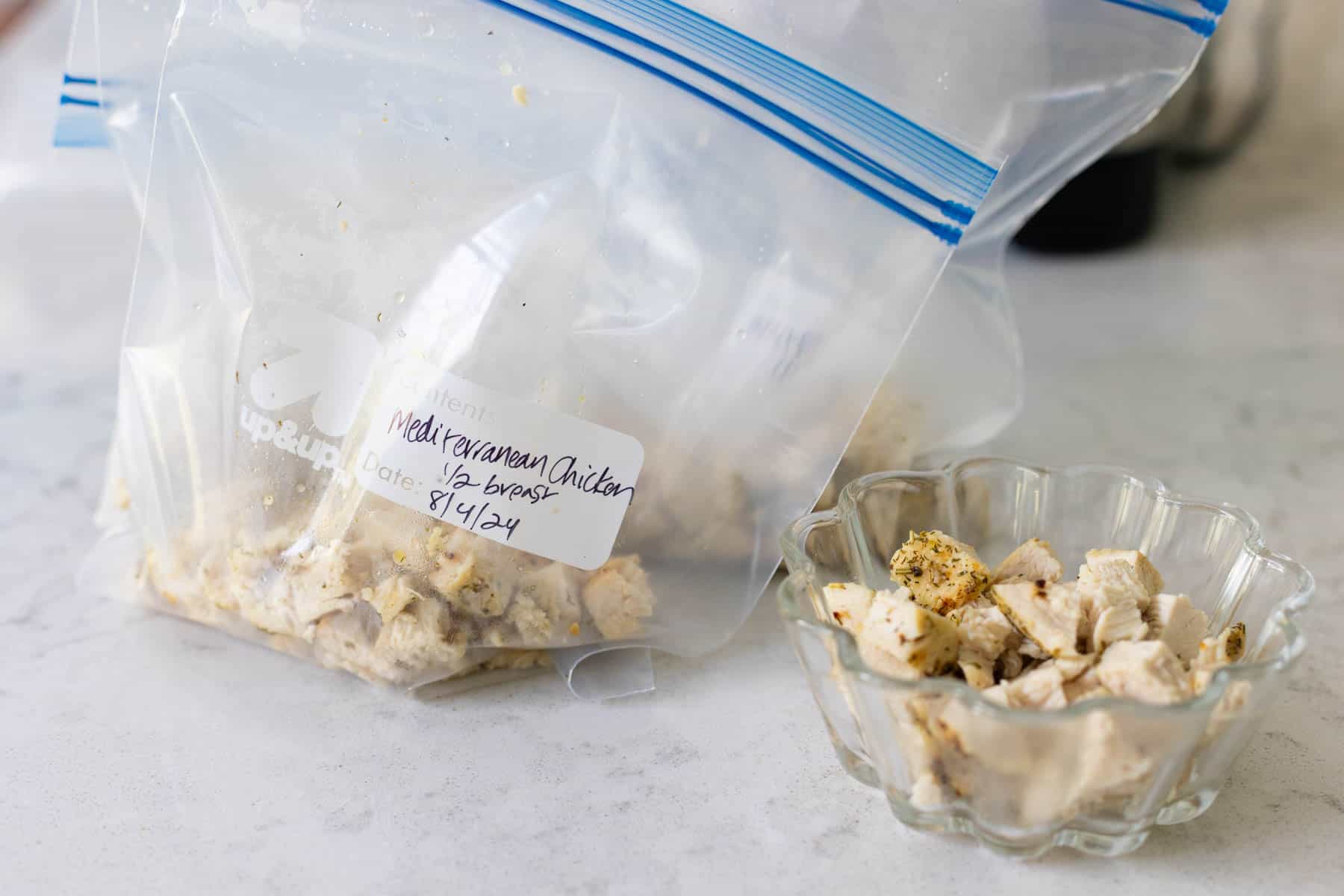 The diced chicken has been added to a freezer bag.