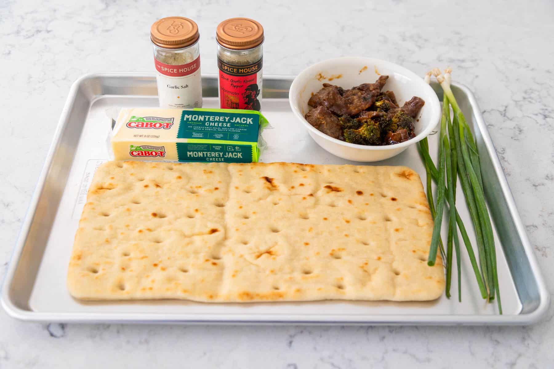 The ingredients to make the mongolian flatbread are on the counter.