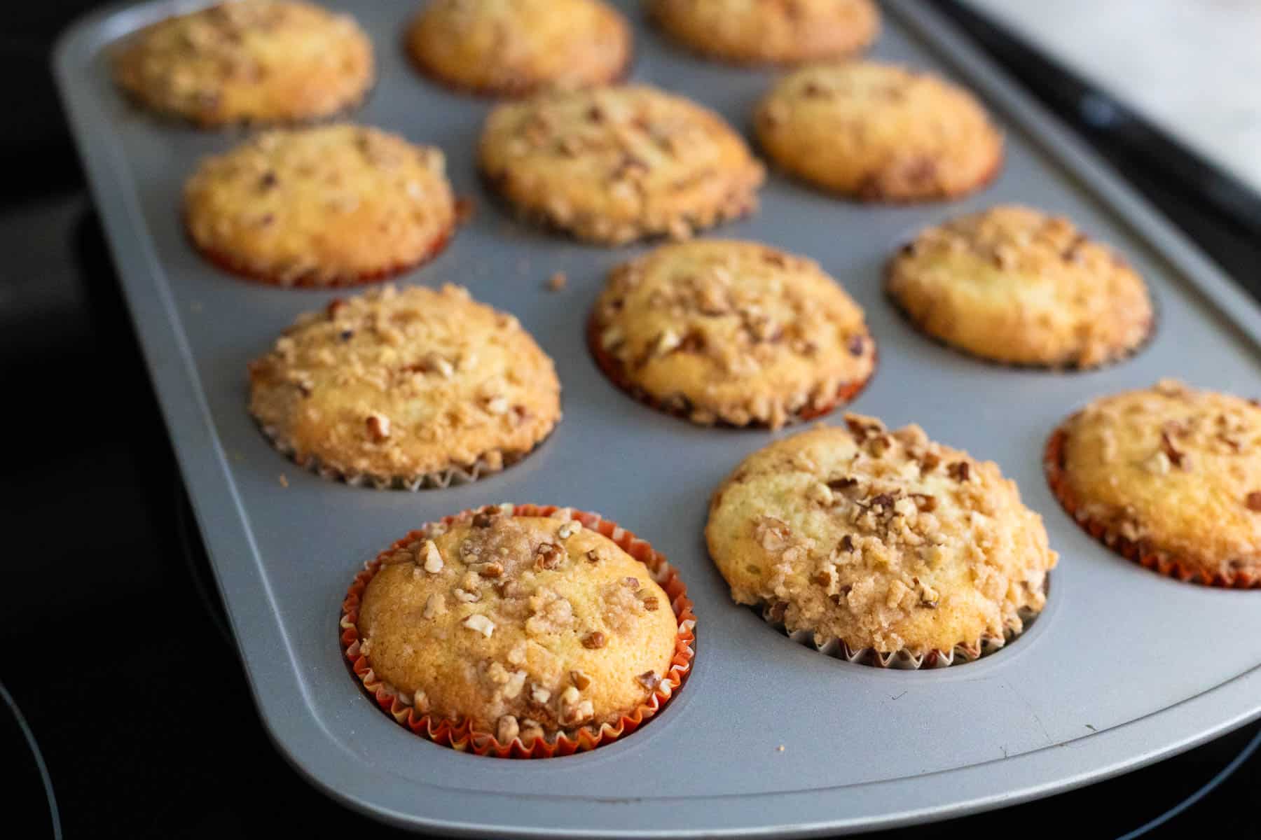 The muffins have just come out of the oven and are a golden brown color.