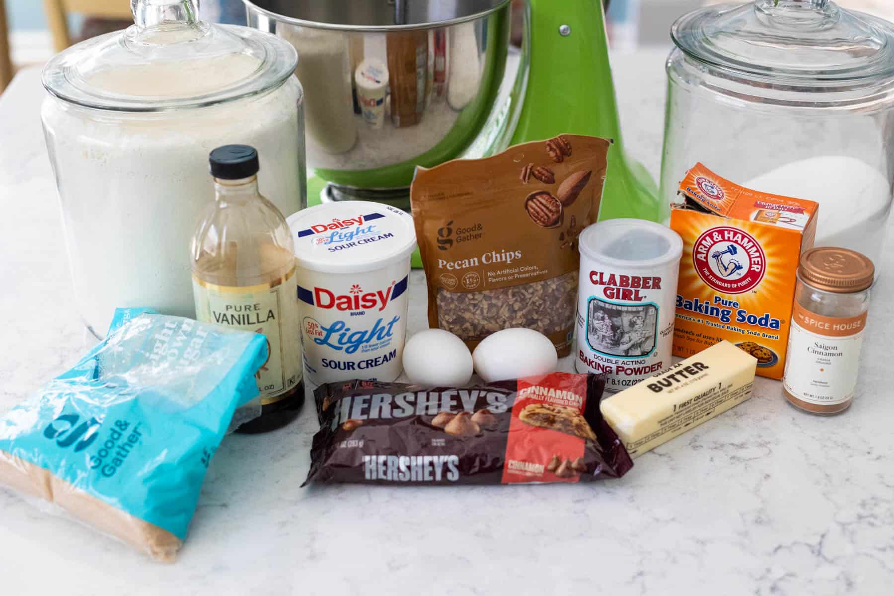 The ingredients to make cinnamon streusel muffins are on the counter.