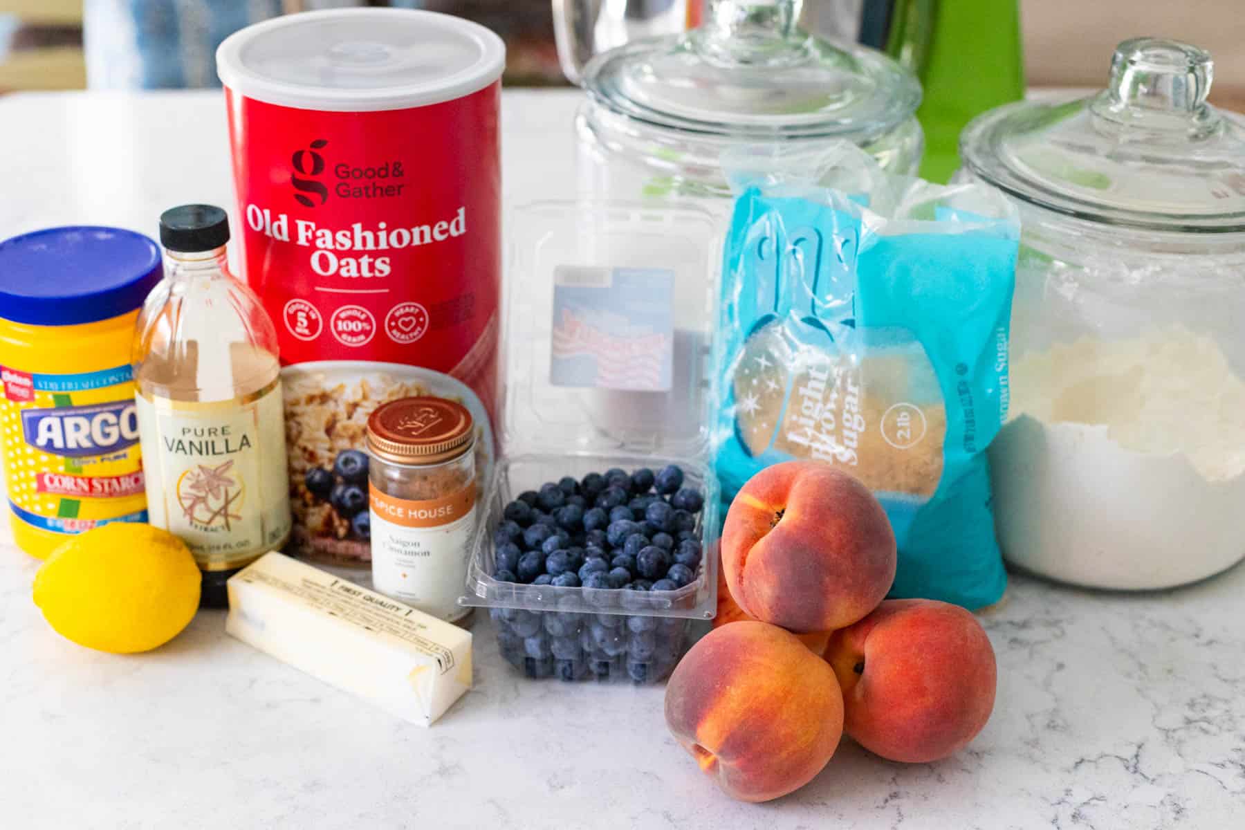 The ingredients to make the peaches and blueberry crisp are on the counter.