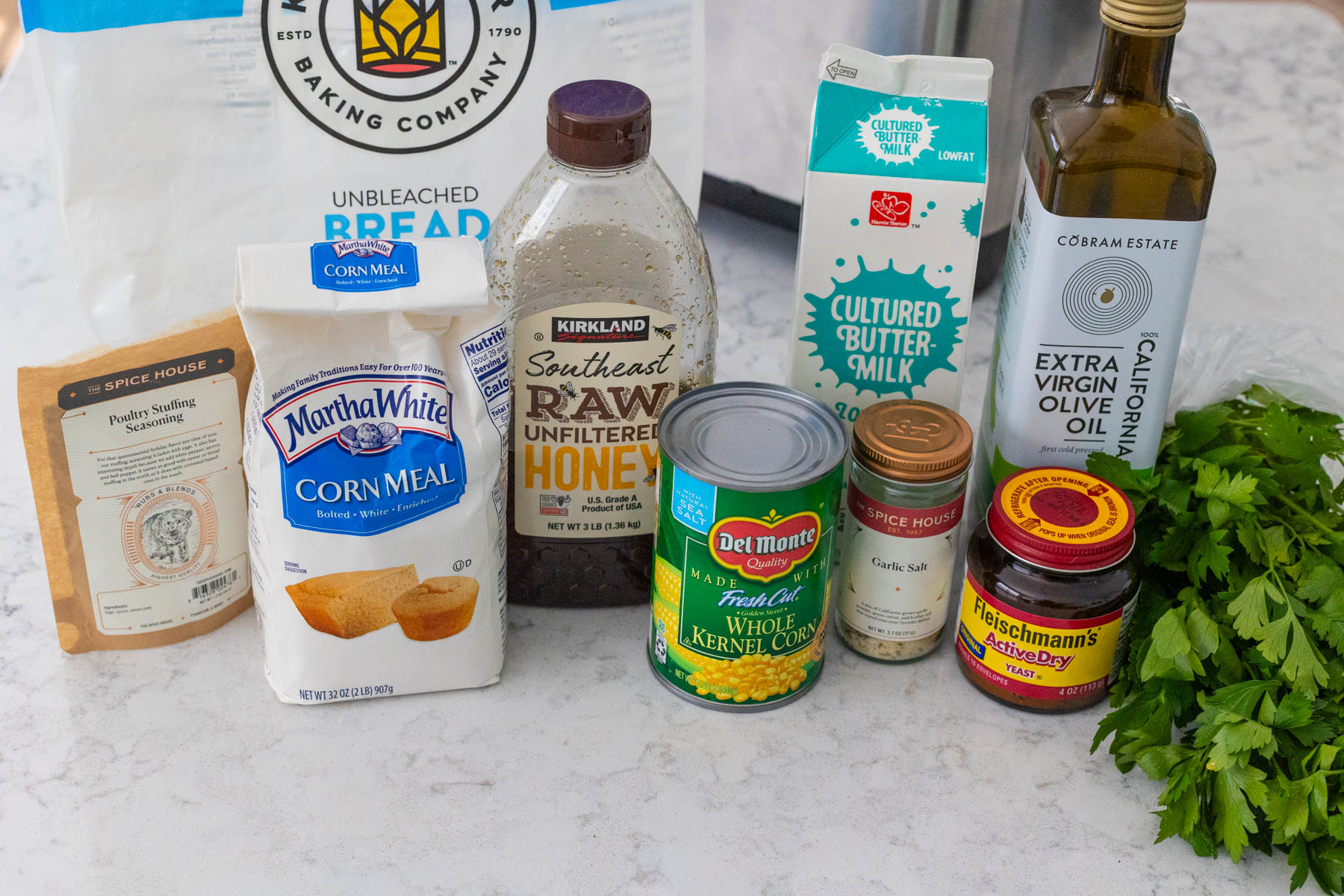 The ingredients to make the bread machine bread are on the counter.