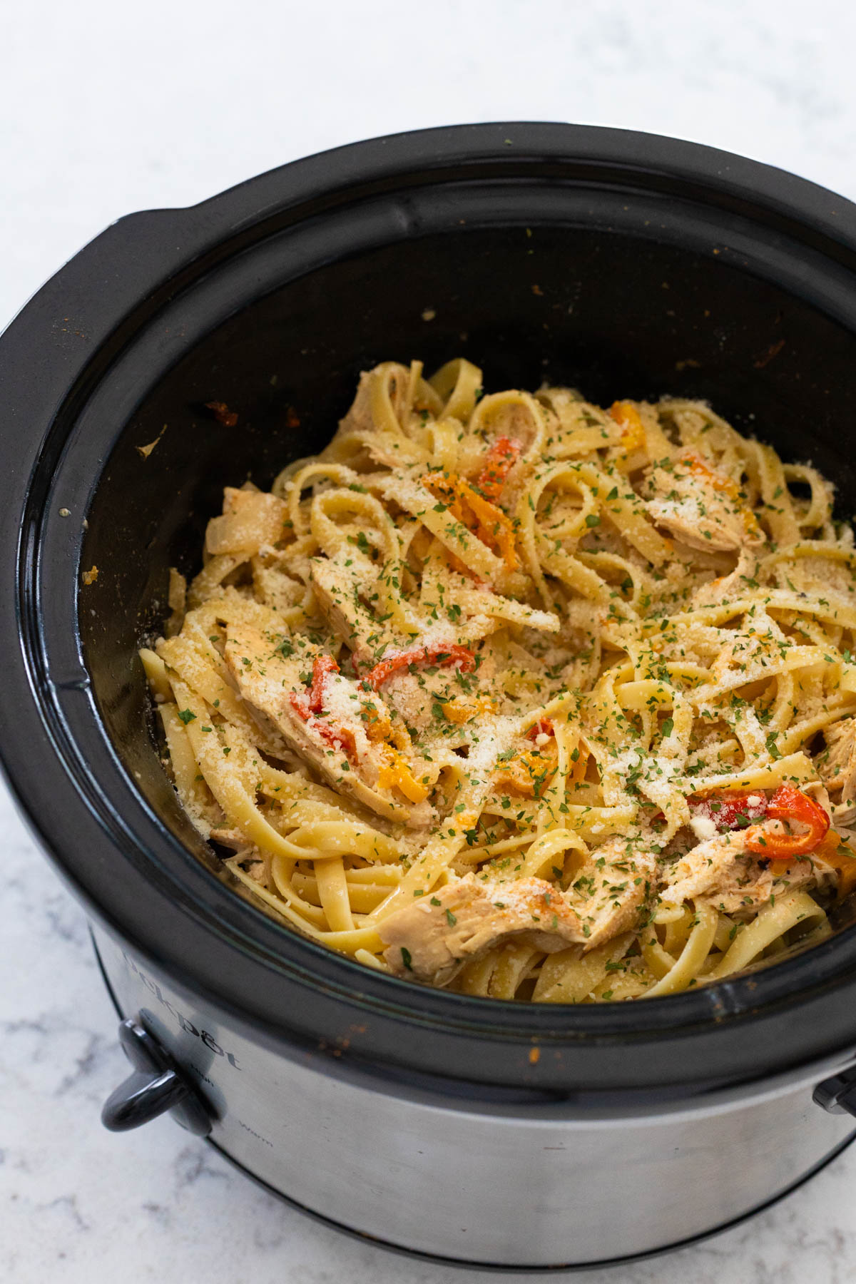 The finished pasta dish is in the slowcooker.