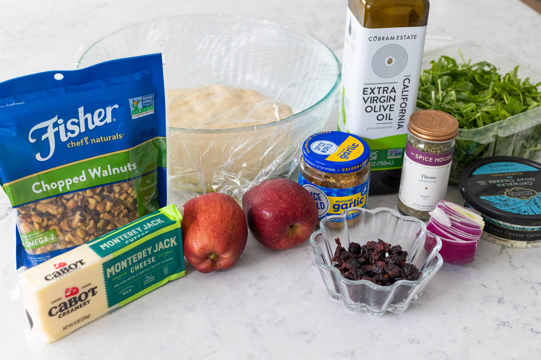 The ingredients to make the pizza are on the counter.